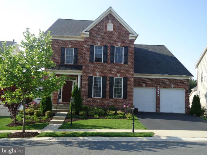 8919 Ricky Trevor Road Perry Hall, MD 21128 - Photo 27 of 27 a front view of a house with a garden