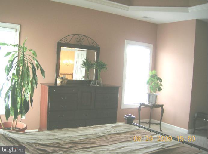8919 Ricky Trevor Road Perry Hall, MD 21128 - Photo 4 of 27 a bedroom with a bed and a window