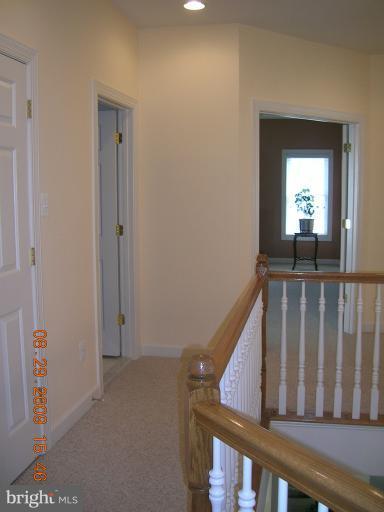 8919 Ricky Trevor Road Perry Hall, MD 21128 - Photo 8 of 27 a view of a balcony and wooden floor