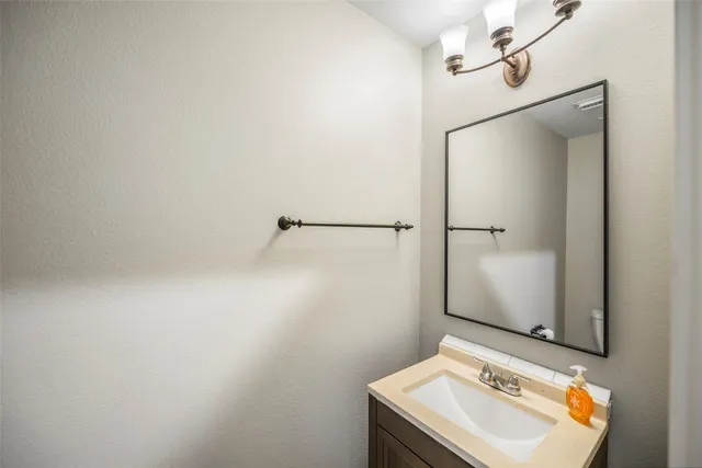 a bathroom with a sink and shower