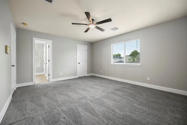 an empty room with window and windows