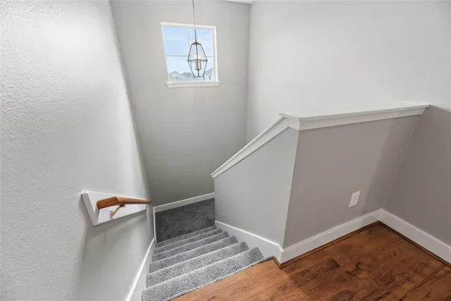 a view of a hallway with staircase