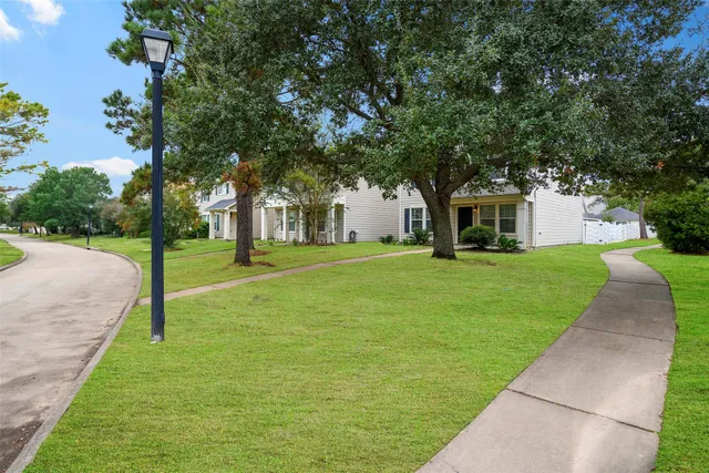 a view of house with yard