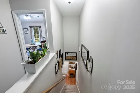 a view of a hallway with seating area