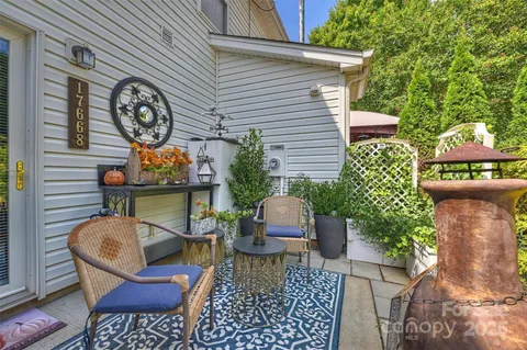 a view of a chairs and table in a patio