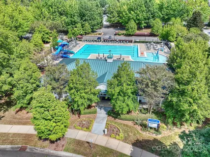 an aerial view of a house with a yard and garden