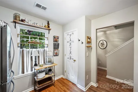 a view of front door with wooden floor