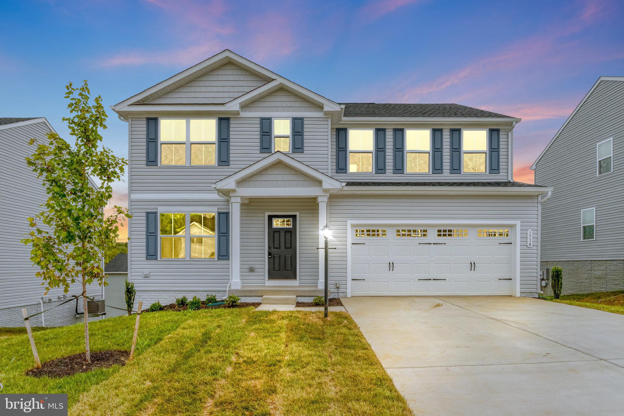 1714 Nebula Lane Stafford, VA 22554 - Photo 1 of 29 a front view of a house with garden