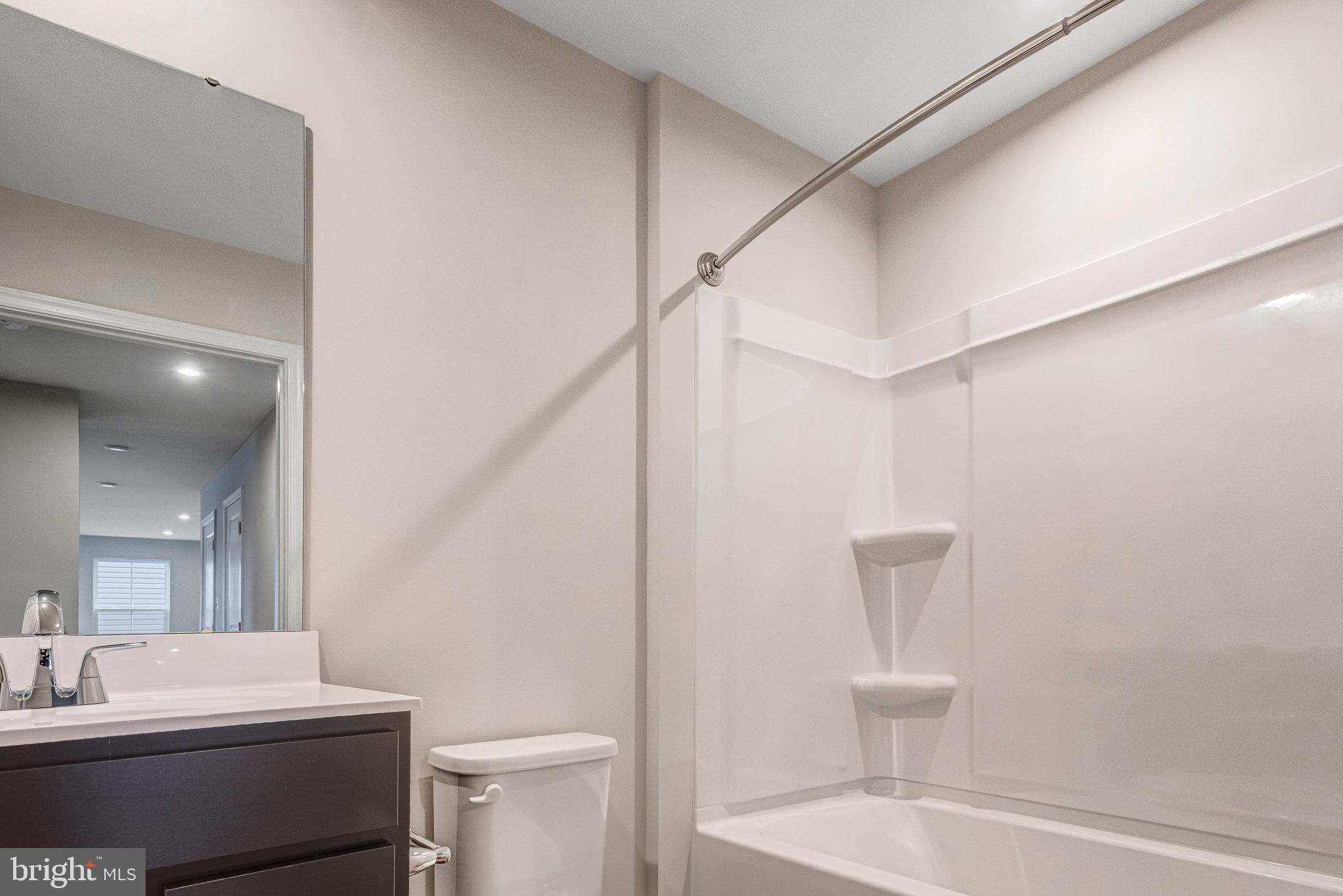 1714 Nebula Lane Stafford, VA 22554 - Photo 11 of 29 a bathroom with a sink a toilet and shower