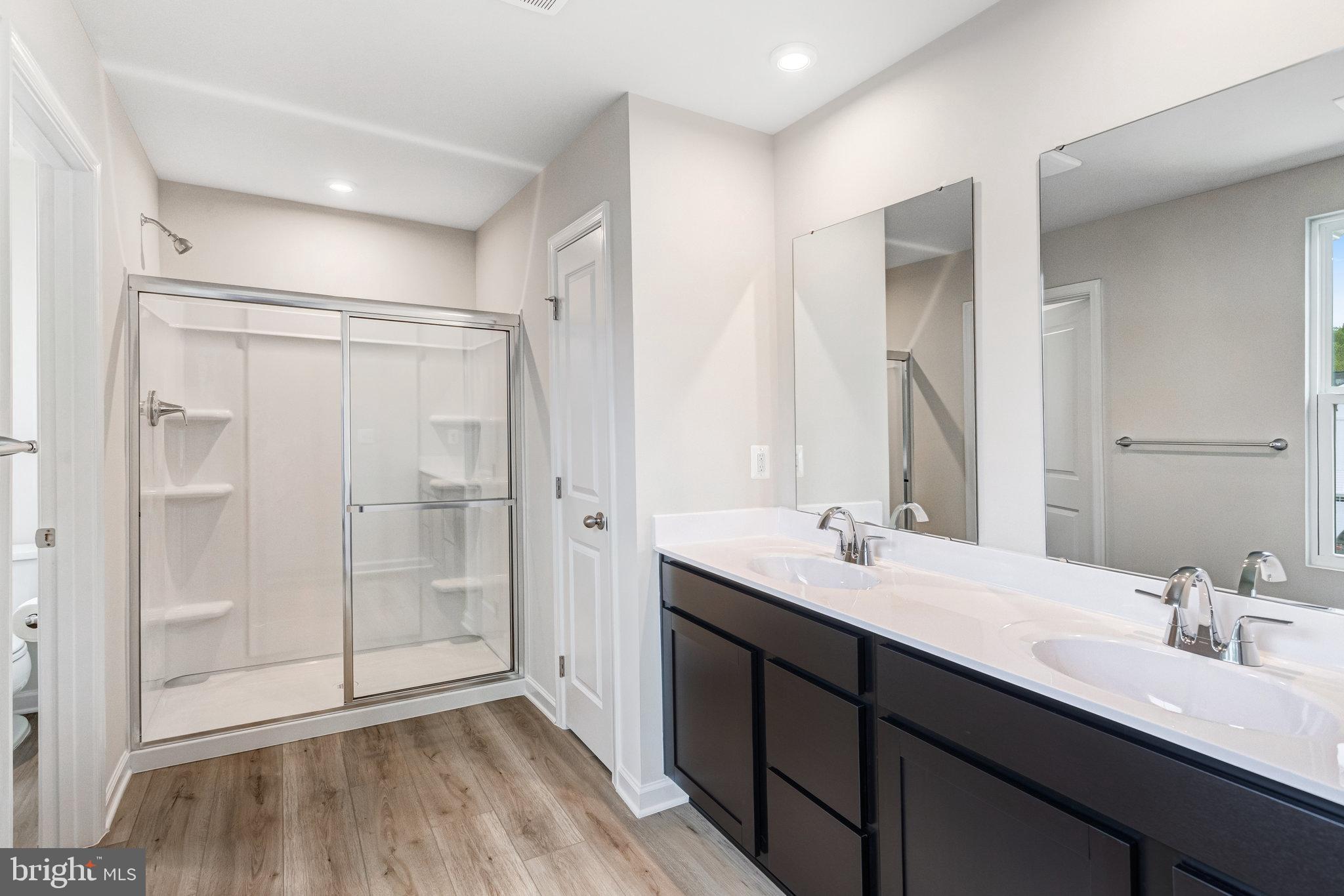 1714 Nebula Lane Stafford, VA 22554 - Photo 14 of 29 a bathroom with a double vanity sink mirror and shower