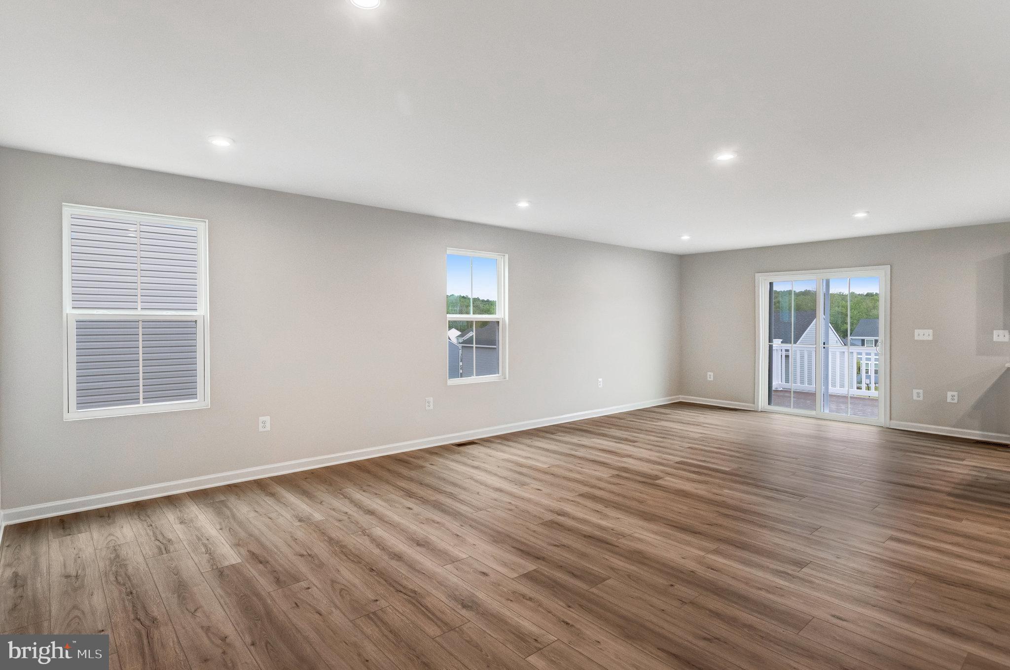 1714 Nebula Lane Stafford, VA 22554 - Photo 6 of 29 a view of an empty room with wooden floor and a window