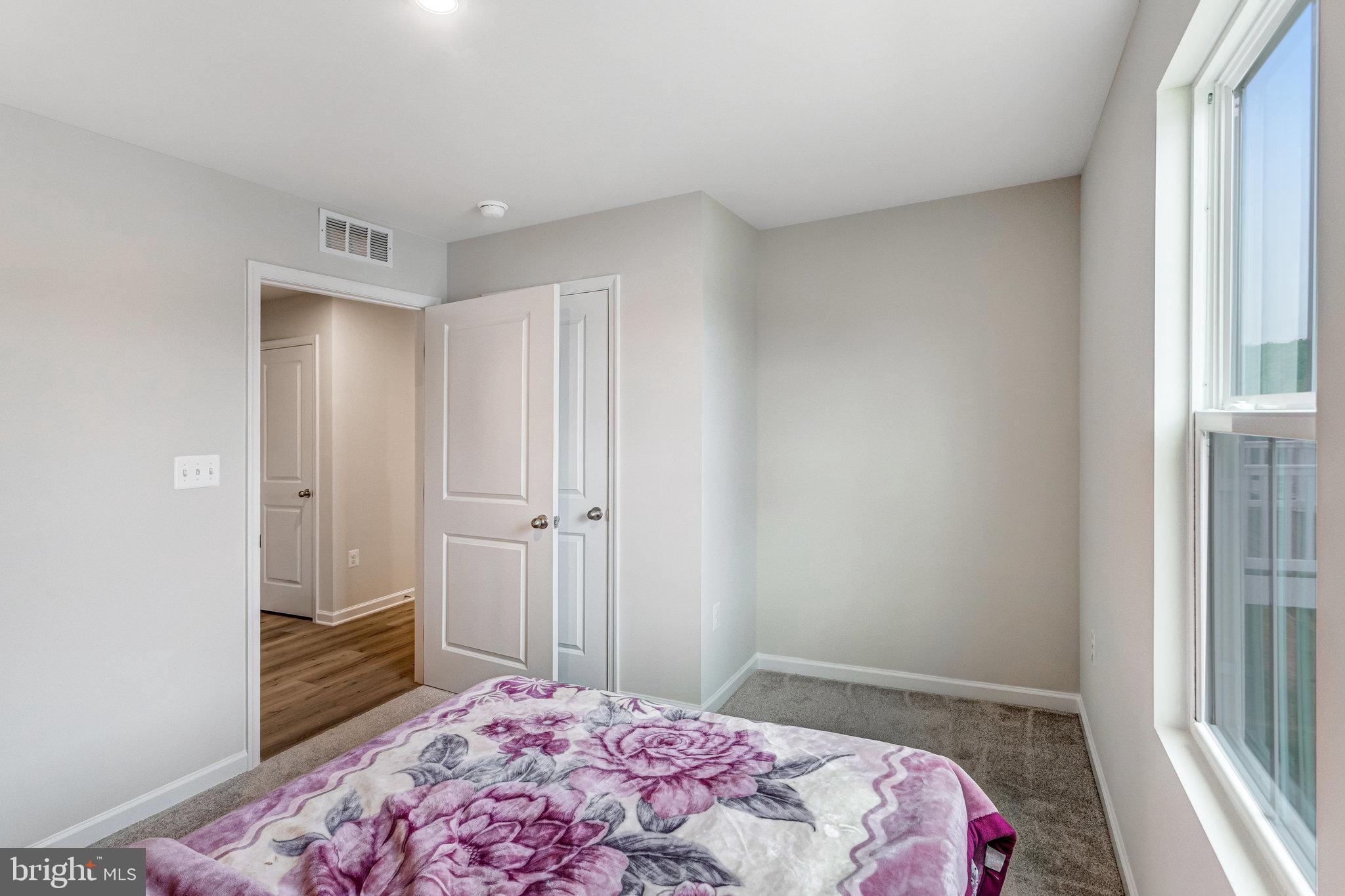 1714 Nebula Lane Stafford, VA 22554 - Photo 10 of 29 a bedroom with a bed and a window