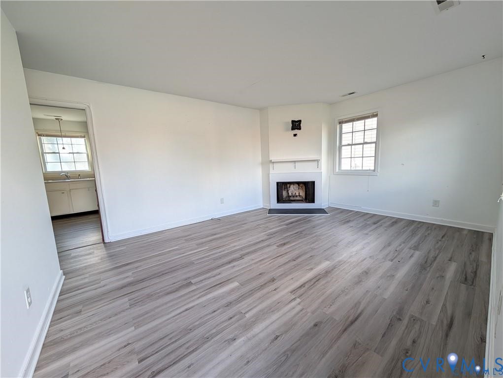 514 German School Road Richmond, VA 23225 - Photo 4 of 11 Unfurnished living room with light wood-type floor