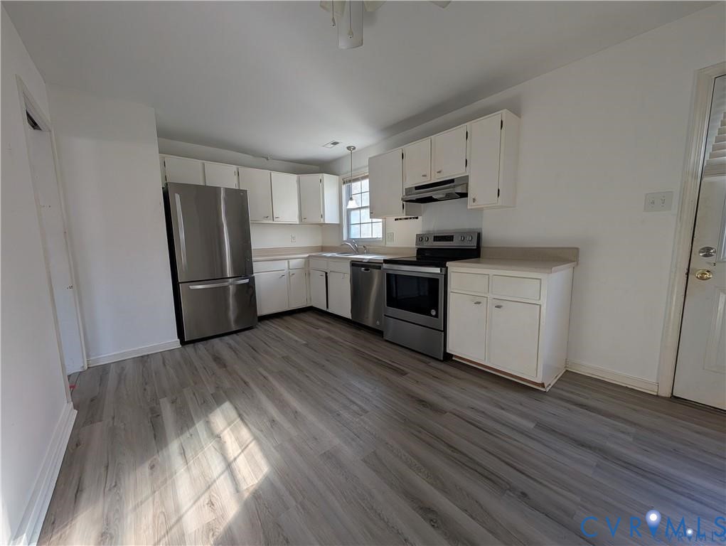 514 German School Road Richmond, VA 23225 - Photo 5 of 11 Kitchen featuring white cabinets, stainless steel
