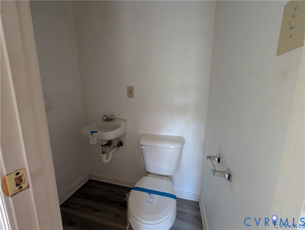 514 German School Road Richmond, VA 23225 - Photo 6 of 11 Bathroom featuring toilet and dark wood-type floor