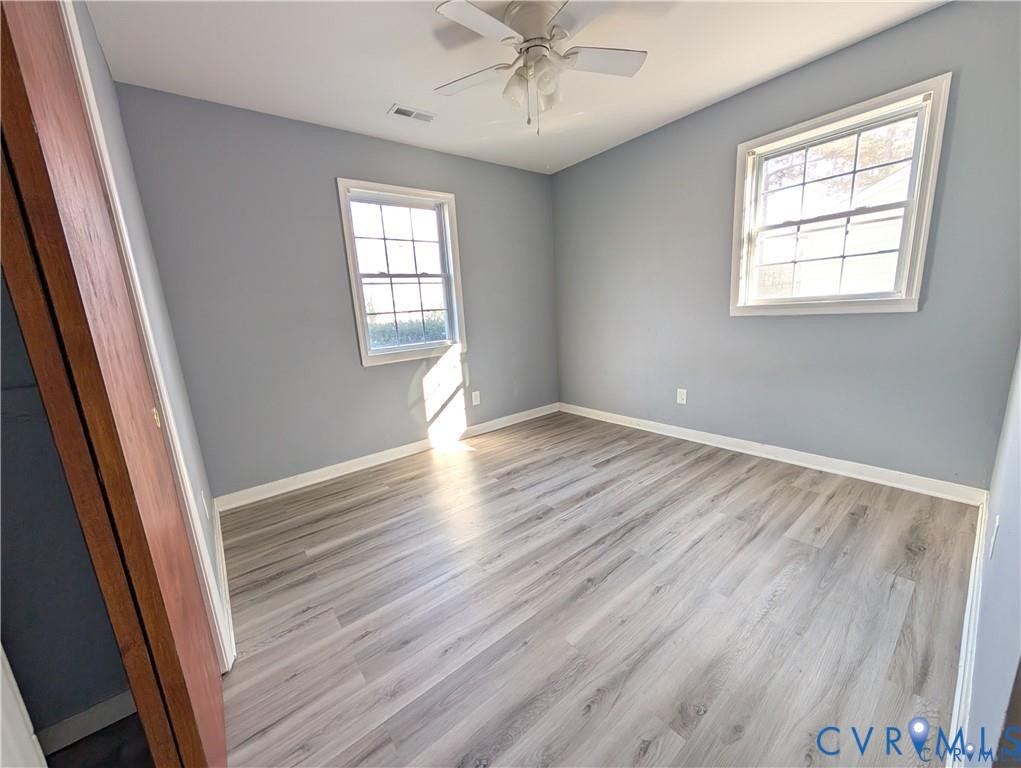 514 German School Road Richmond, VA 23225 - Photo 9 of 11 Empty room featuring light wood finished floors an