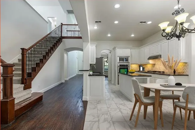 a view of kitchen with cabinets and wooden floor