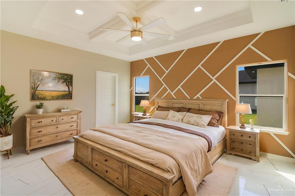 909 Azalea Street Mission, TX 78573 - Photo 14 of 29 Bedroom with coffered ceiling, recessed lighting, ceiling fan, and an accent wall. Picture virtually furnished