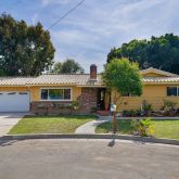 a front view of house with yard and outdoor seating