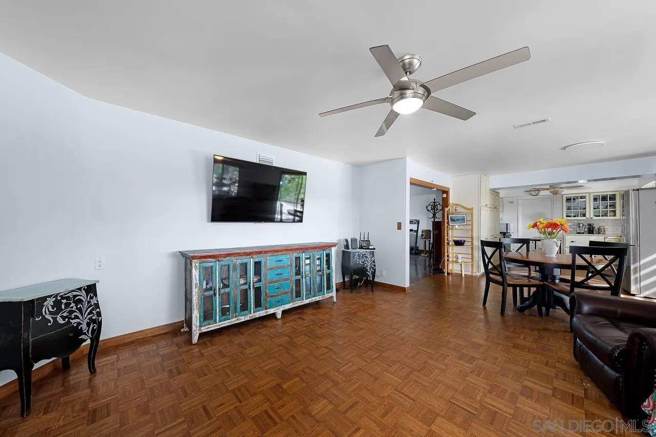 1410 Crestridge Drive Oceanside, CA 92054 - Photo 13 of 71 a living room with furniture and a flat screen tv