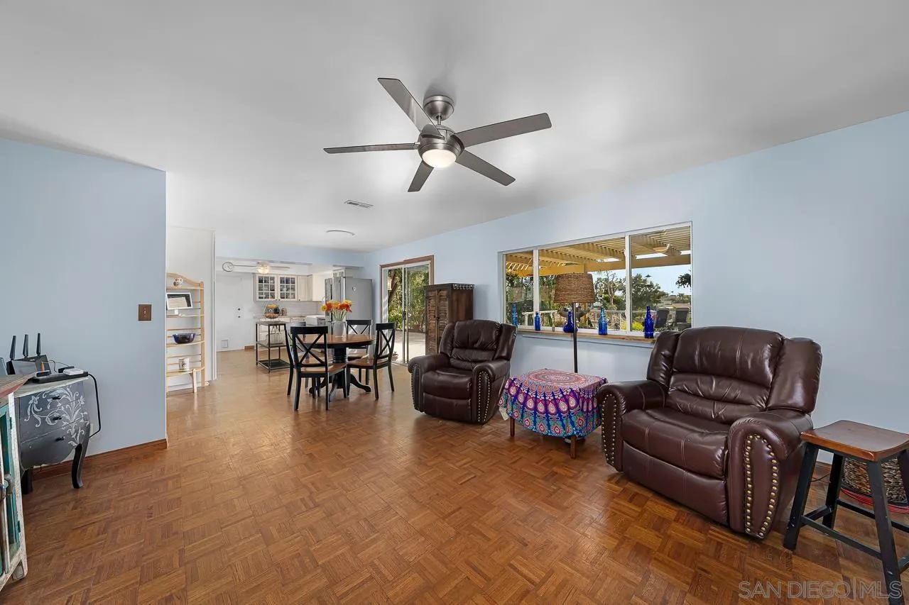 1410 Crestridge Drive Oceanside, CA 92054 - Photo 15 of 71 a living room with furniture and a chandelier