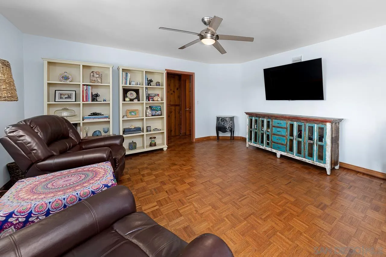 1410 Crestridge Drive Oceanside, CA 92054 - Photo 16 of 71 a living room with furniture and a flat screen tv