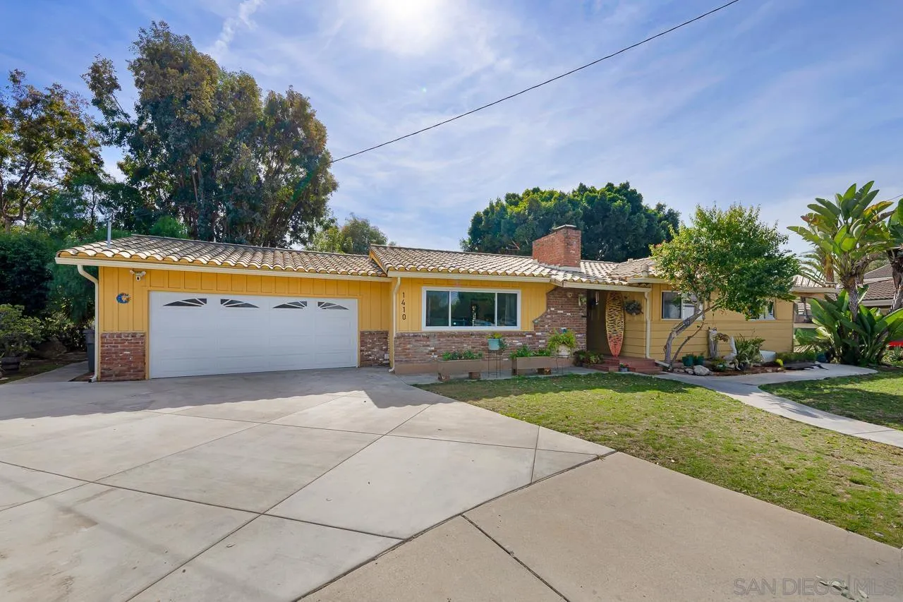 1410 Crestridge Drive Oceanside, CA 92054 - Photo 2 of 71 a front view of a house with garden