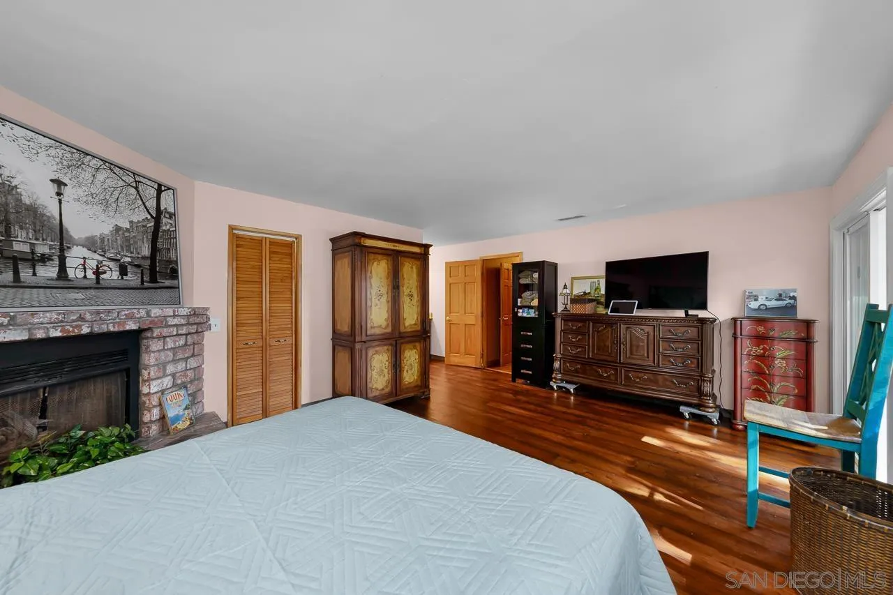 1410 Crestridge Drive Oceanside, CA 92054 - Photo 21 of 71 a bedroom with furniture and a flat screen tv