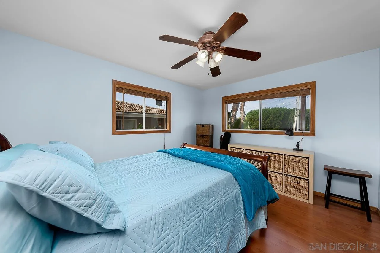 1410 Crestridge Drive Oceanside, CA 92054 - Photo 24 of 71 a bedroom with a large bed and a window