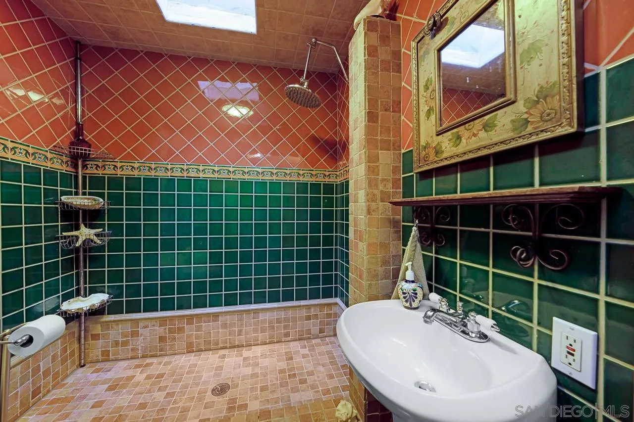 1410 Crestridge Drive Oceanside, CA 92054 - Photo 28 of 71 a bathroom with a sink toilet and shower