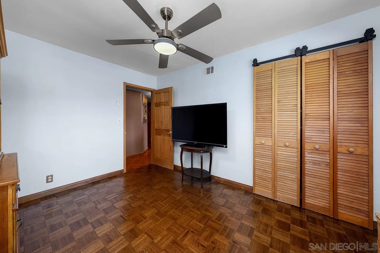 1410 Crestridge Drive Oceanside, CA 92054 - Photo 34 of 71 a living room with furniture and a flat screen tv