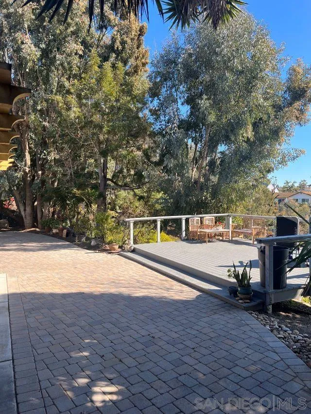 1410 Crestridge Drive Oceanside, CA 92054 - Photo 43 of 71 a view of a swimming pool with an outdoor seating