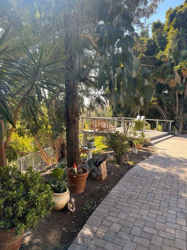 1410 Crestridge Drive Oceanside, CA 92054 - Photo 56 of 71 a view of a patio with table and chairs and potted plants