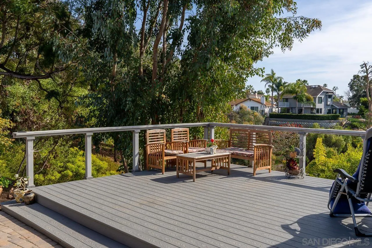 1410 Crestridge Drive Oceanside, CA 92054 - Photo 64 of 71 a view of a deck with chairs next to a yard