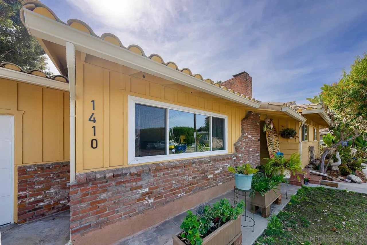 1410 Crestridge Drive Oceanside, CA 92054 - Photo 71 of 71 a front view of a house with garden