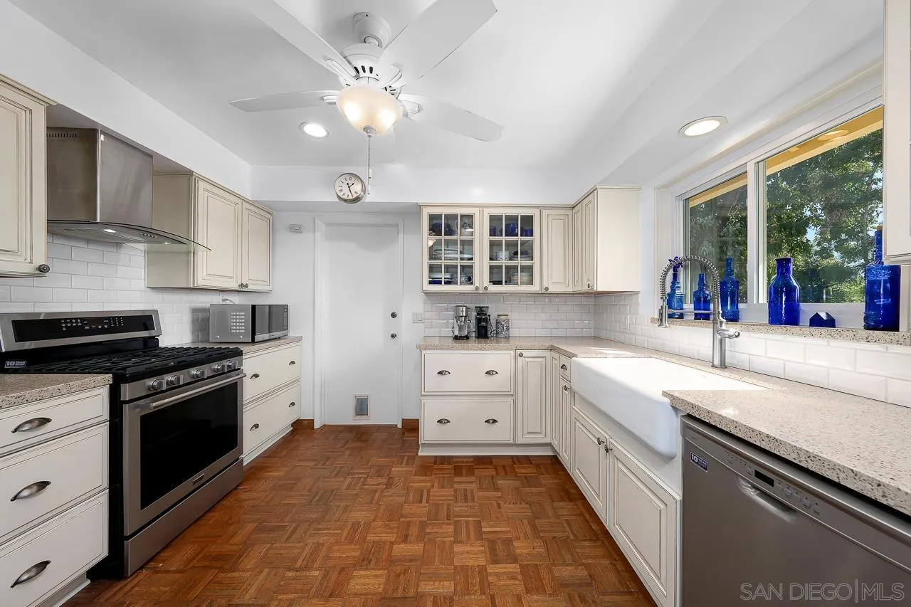 1410 Crestridge Drive Oceanside, CA 92054 - Photo 10 of 71 a kitchen with a stove sink and a granite counter tops
