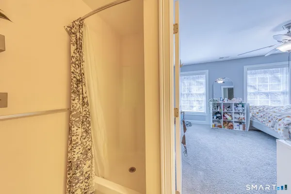 a view of a bedroom with washer and dryer