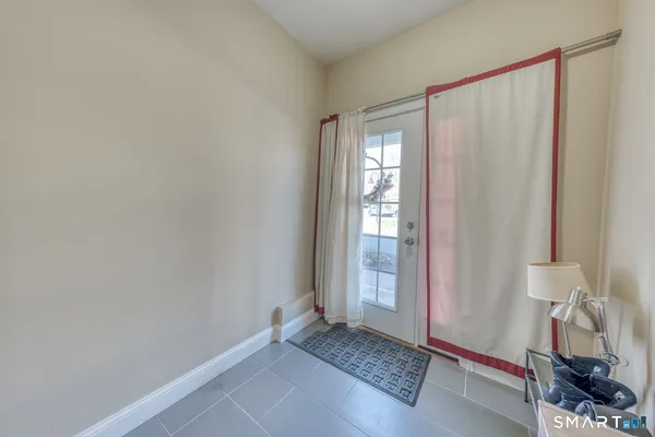 a bedroom with a bed and a chair