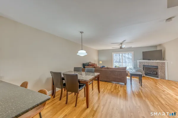 a view of a dining room with furniture window and wooden floor