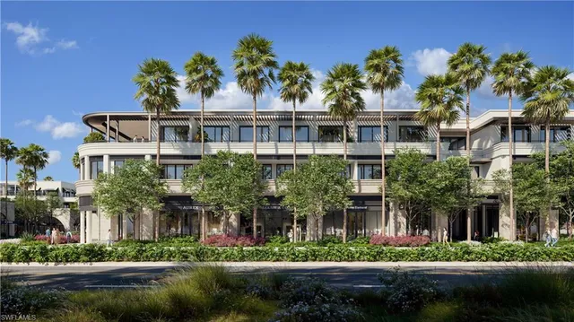 a front view of a residential apartment building with a yard