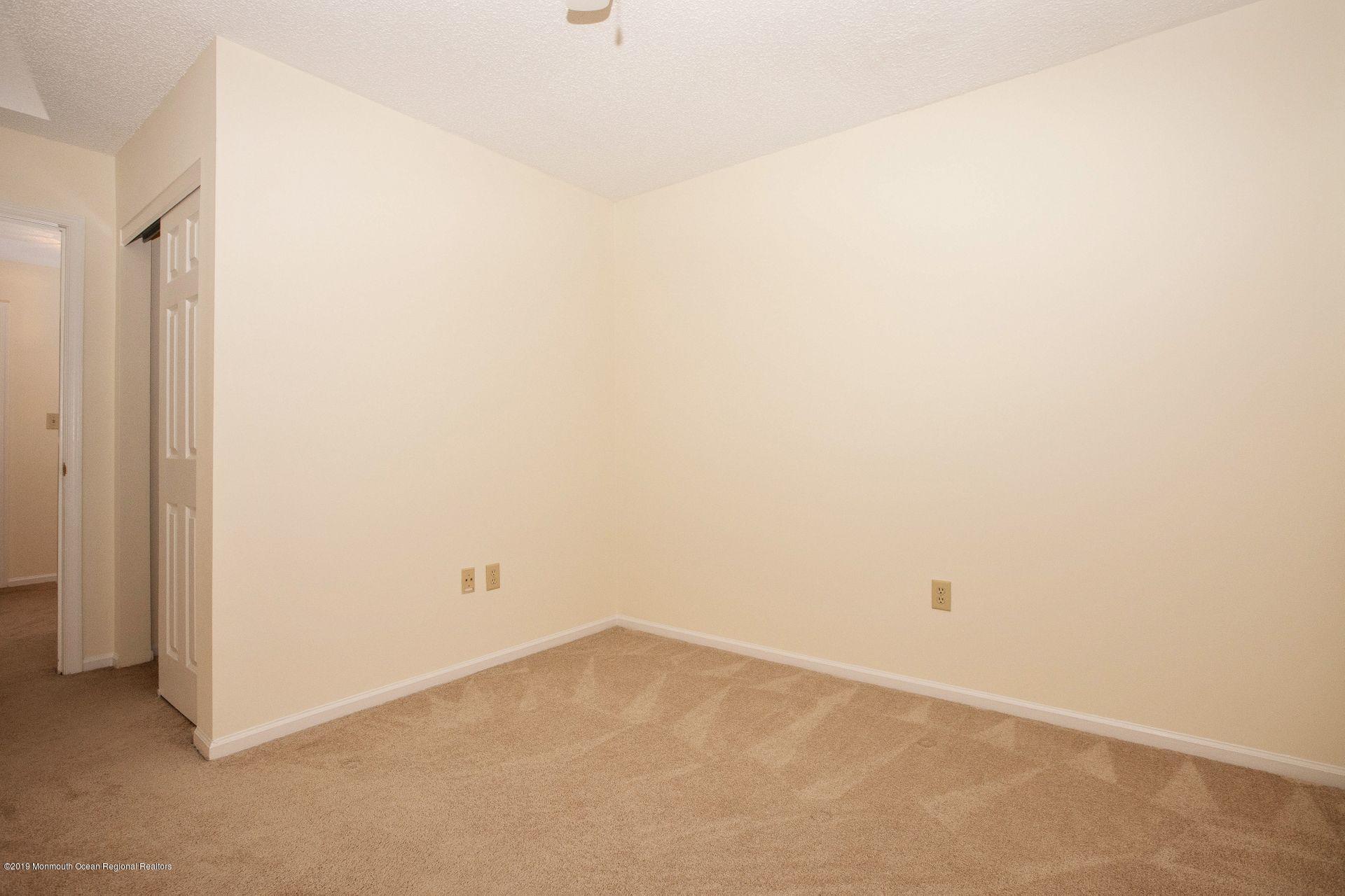 16 Stuart Drive, Unit 8 Freehold, NJ 07728 - Photo 17 of 28 a view of an empty room