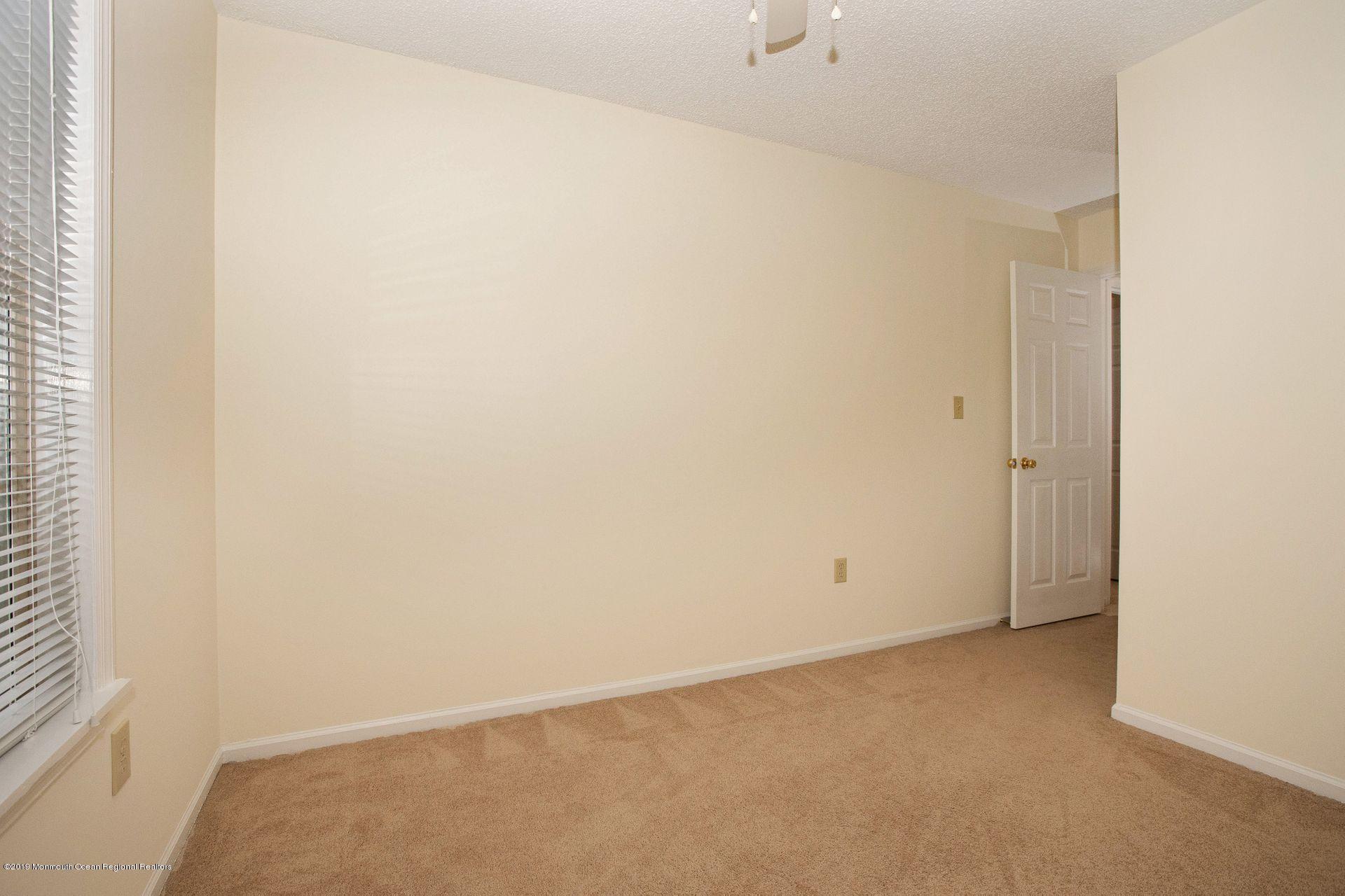 16 Stuart Drive, Unit 8 Freehold, NJ 07728 - Photo 18 of 28 a view of an empty room