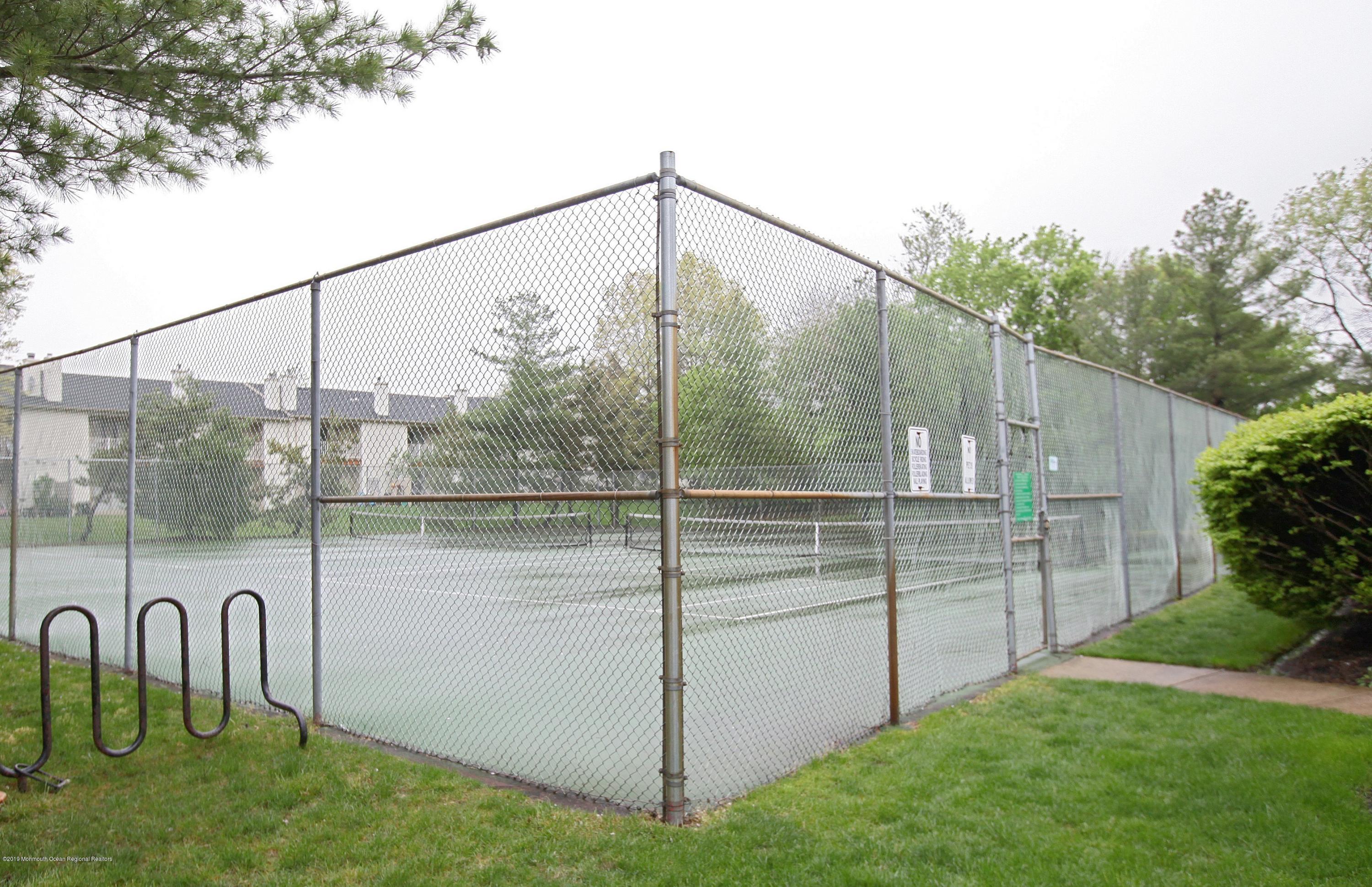 16 Stuart Drive, Unit 8 Freehold, NJ 07728 - Photo 28 of 28 a view of a balcony with chairs
