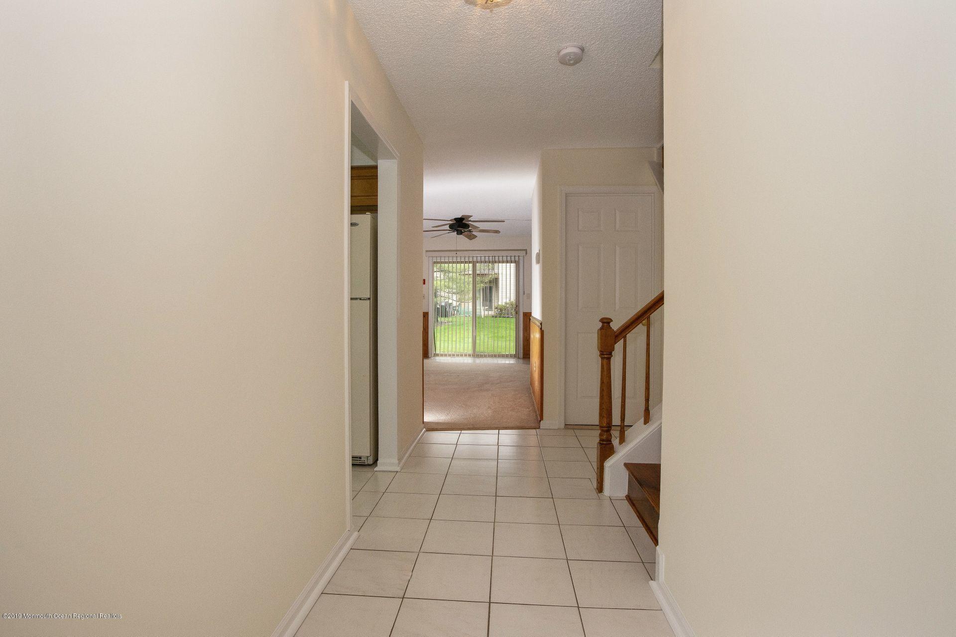 16 Stuart Drive, Unit 8 Freehold, NJ 07728 - Photo 3 of 28 a view of a hallway
