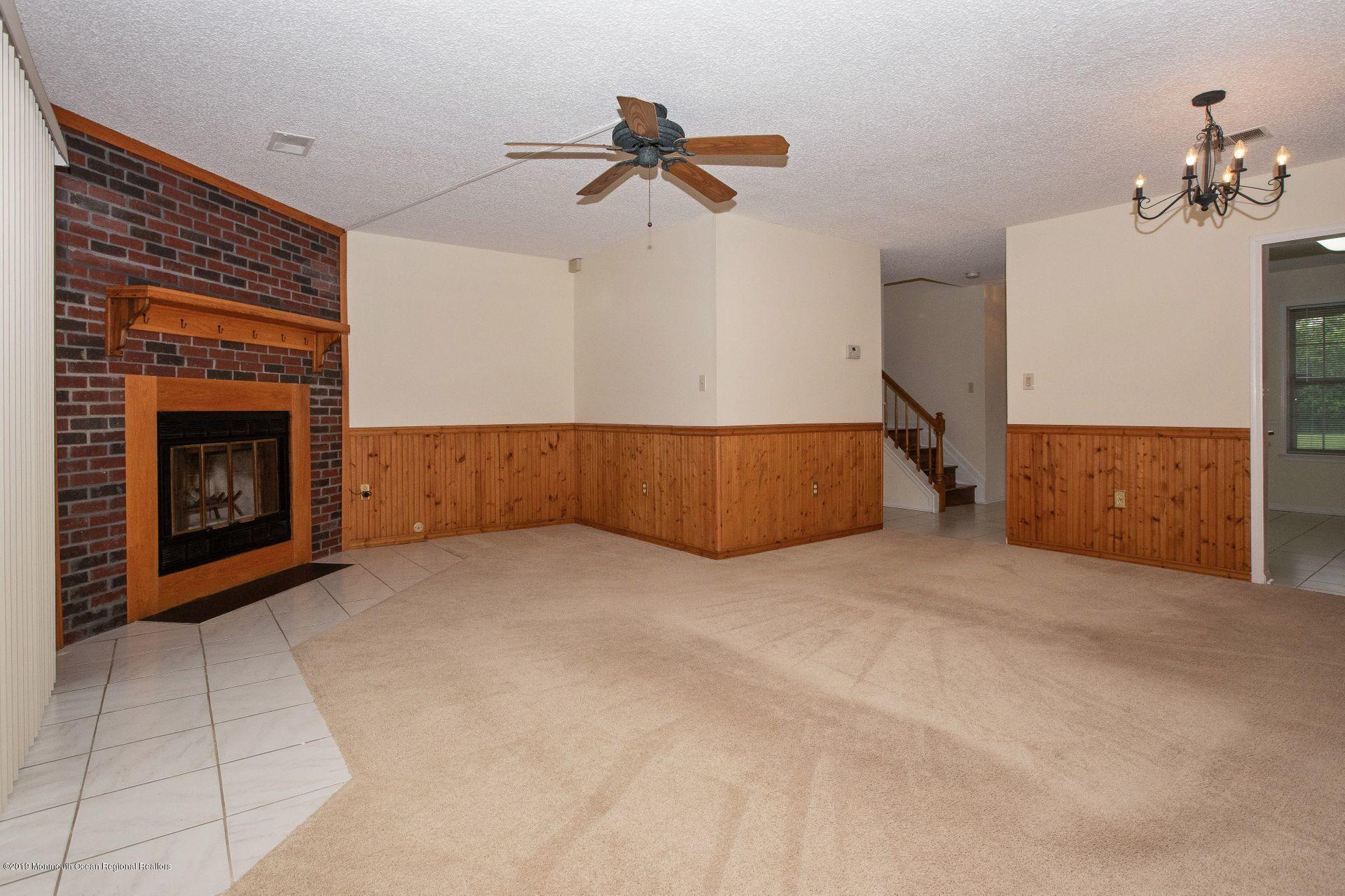 16 Stuart Drive, Unit 8 Freehold, NJ 07728 - Photo 9 of 28 a view of kitchen and a fireplace