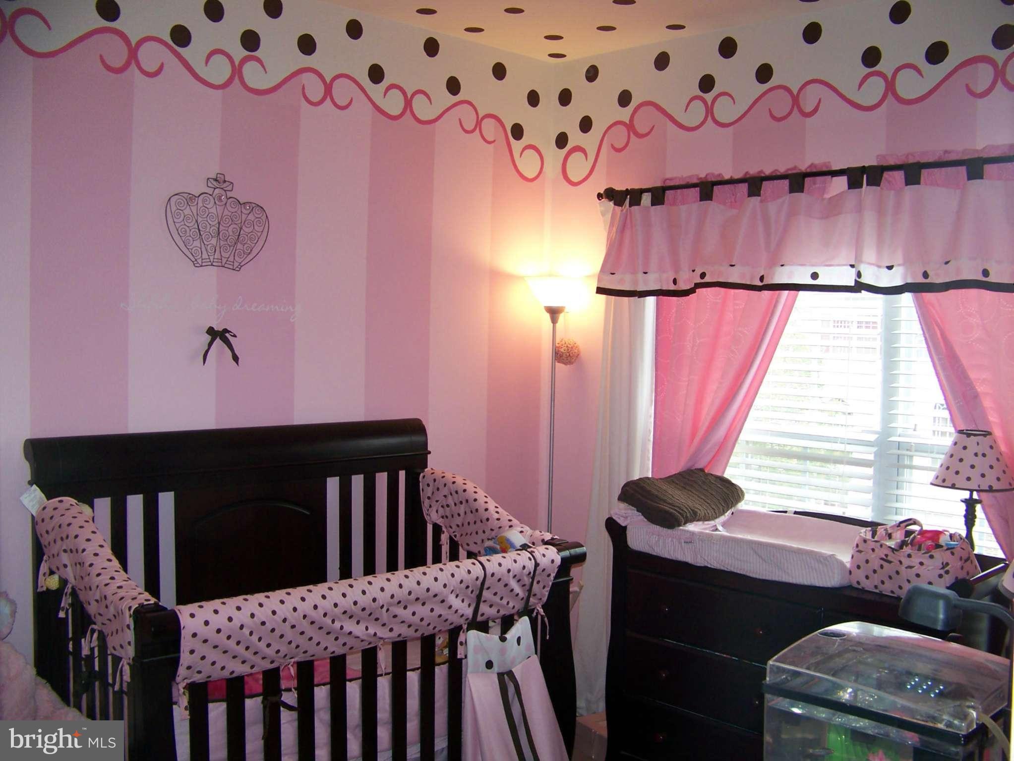 10155 Pale Rose Loop Bristow, VA 20136 - Photo 15 of 25 a bedroom with a bed and a window