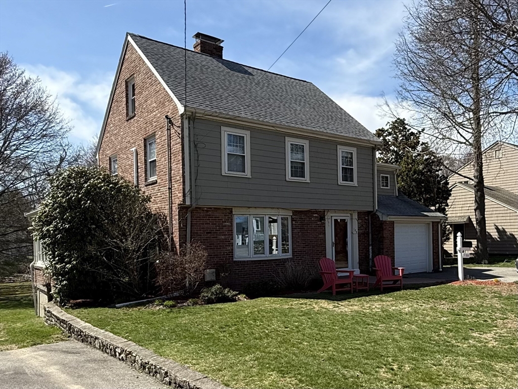 a view of house with yard and green space