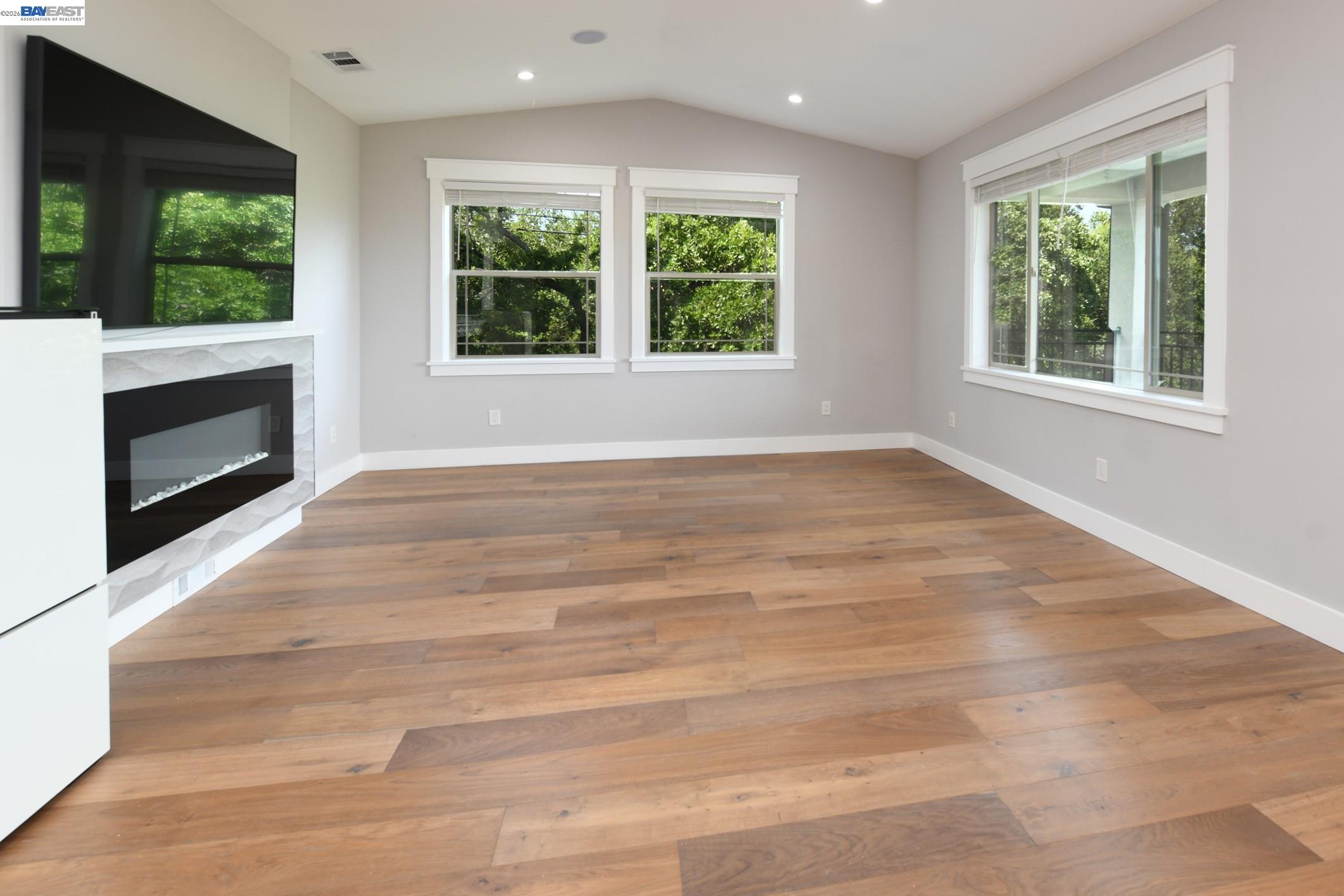 1516 Pleasant Hill Road Lafayette, CA 94549 - Photo 7 of 38 a view of an empty room with wooden floor and a window
