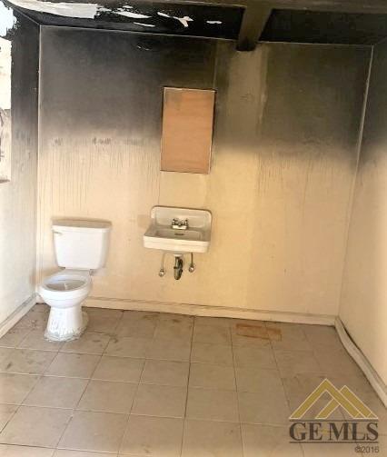 Undisclosed Address Bakersfield, CA 93305 - Photo 12 of 16 a bathroom with a toilet