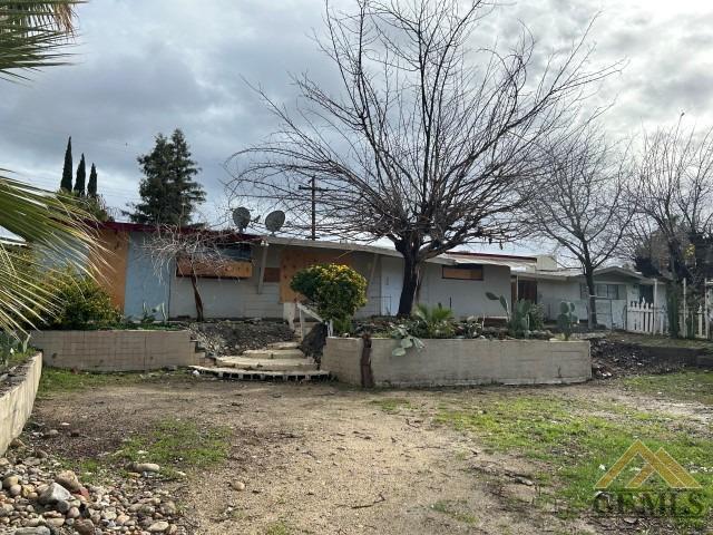 Undisclosed Address Bakersfield, CA 93305 - Photo 16 of 16 a front view of a house with swing plants